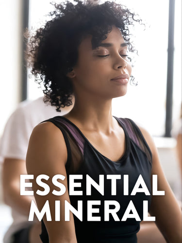 A young African American woman meditates with eyes closed, overlaid with 'ESSENTIAL MINERAL' text.