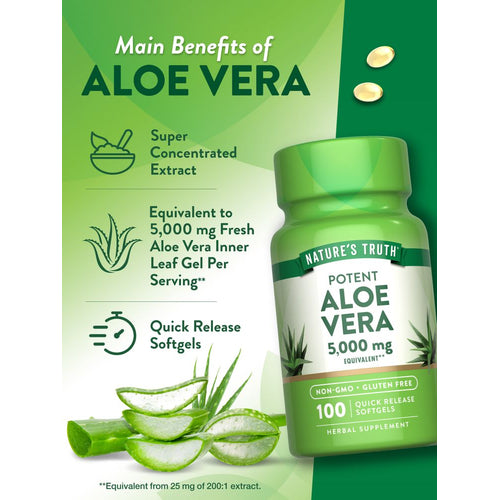 Hand holding two yellow 5,000 mg equivalent Aloe Vera softgels against a bulk scale for size reference.