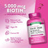 Two pink liquid softgels for Hair, Skin & Nails, each contains 5,000 mcg of Biotin per serving.