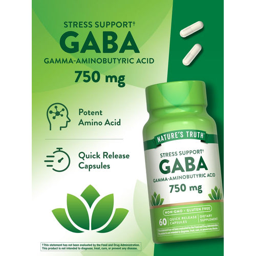 Two white capsules labeled as GABA 750 mg are shown on a scale.