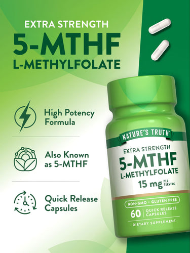 A hand holding two white L-Methylfolate 15 mg capsules.