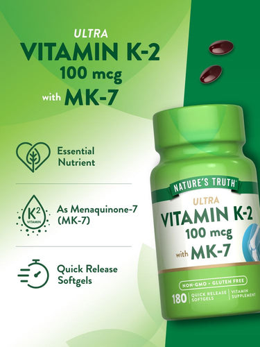 A hand holding a bottle of dark red Vitamin K-2 100 mcg Softgels next to a scale, displaying bulk measurement.