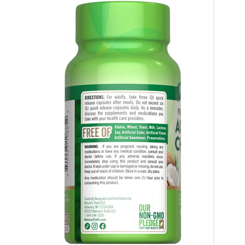 A hand holding a 780 mg activated charcoal capsule, ideal for detox and digestion.