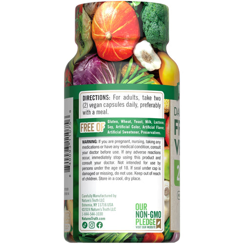 Hand holding NT Super Fruits and Veggies bottle containing 60 vegetable capsules.