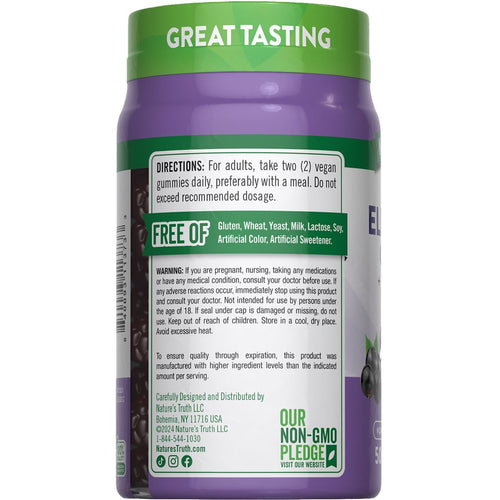 A hand holds a bottle of NT Elderberry Complex with 50 vegan gummies for immune support.