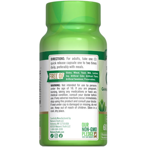 A bottle containing 60 capsules of GABA, each with 750 mg, placed on a scale. This highlights the bulk quantity aspect.