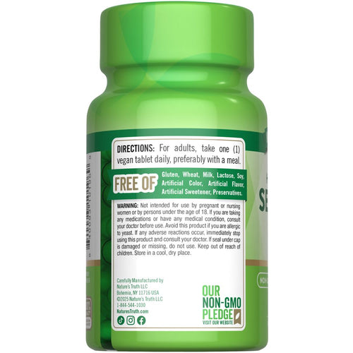 View 7 A hand holding a bulk scale with Selenium 200 mcg tablets.
