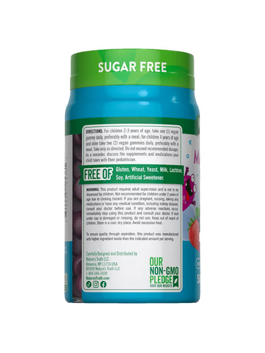 A bottle of NT Kids Magnesium Berry 50 Sugar Free vegan gummies on a hand scale.