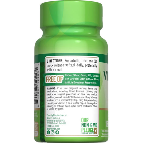 View 7 NA K-2 100 mcg 180 softgels bottle shown on a hand for scale.