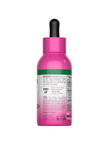 Hand holding NT Collagen Biotin Hyal Liquid 2 fl oz bottle.