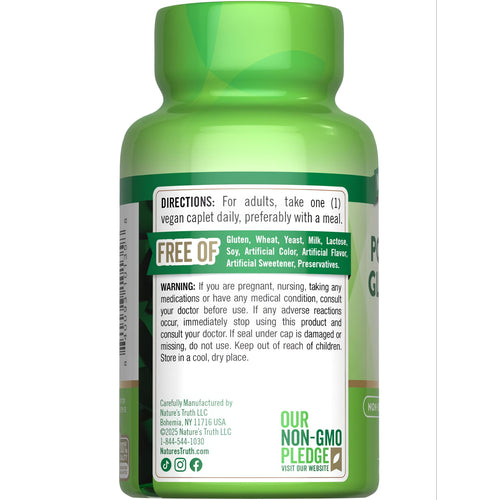 Hand holding a 595 mg vegan caplet on a bulk scale, highlighting the weight and vegan nature of the supplement.